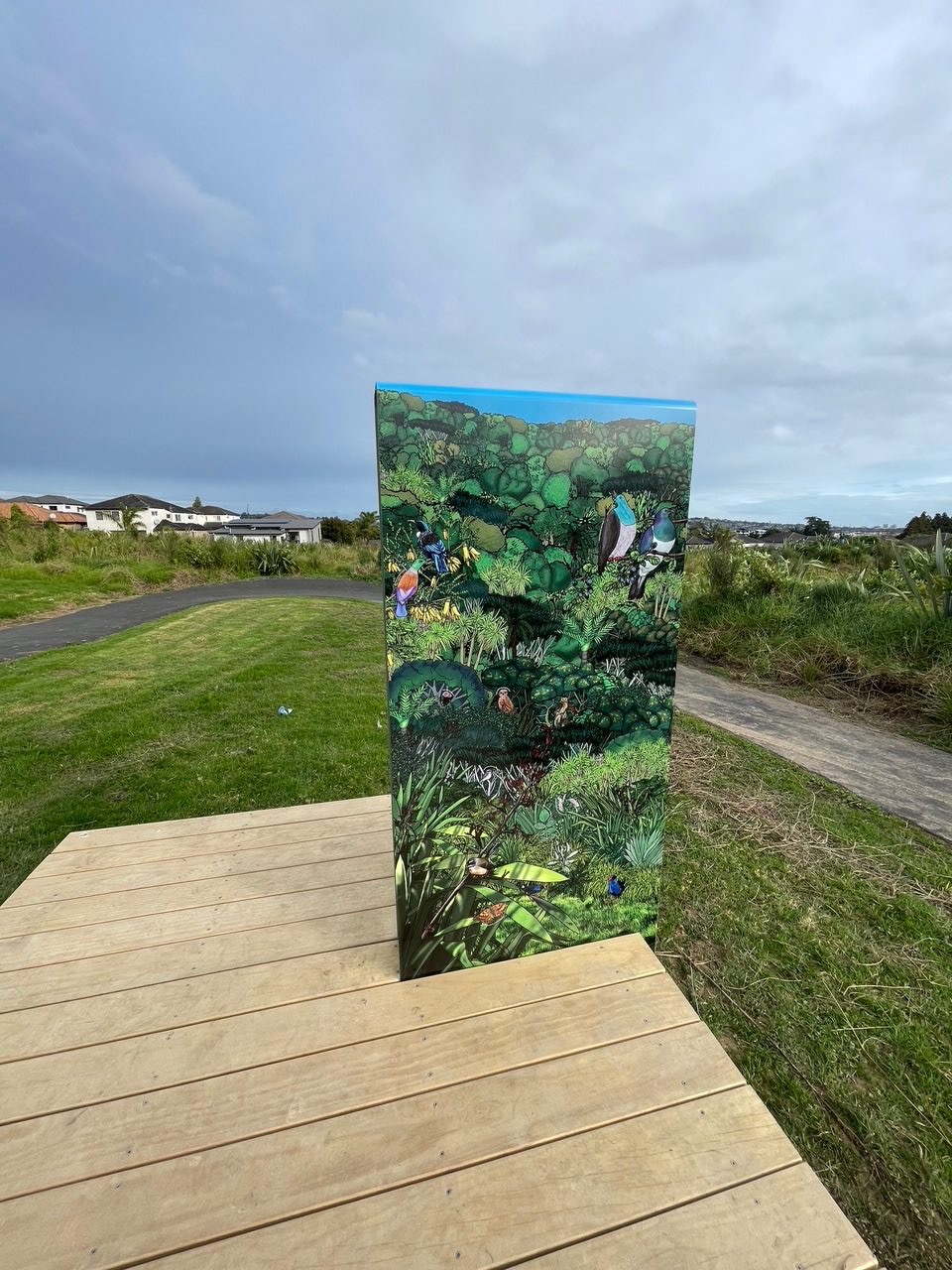Outdoor panel printed with New Zealand native birds and plants