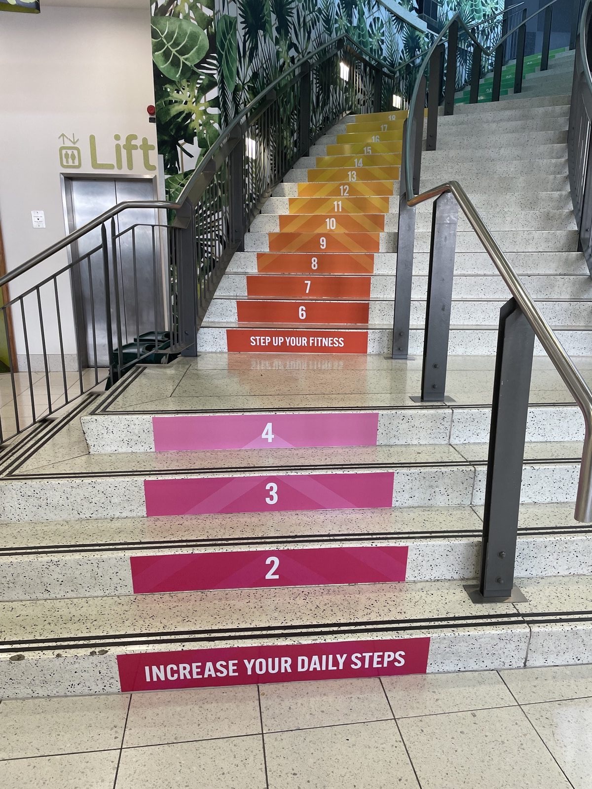 Numbered stair riser vinyl graphics in a public atrium